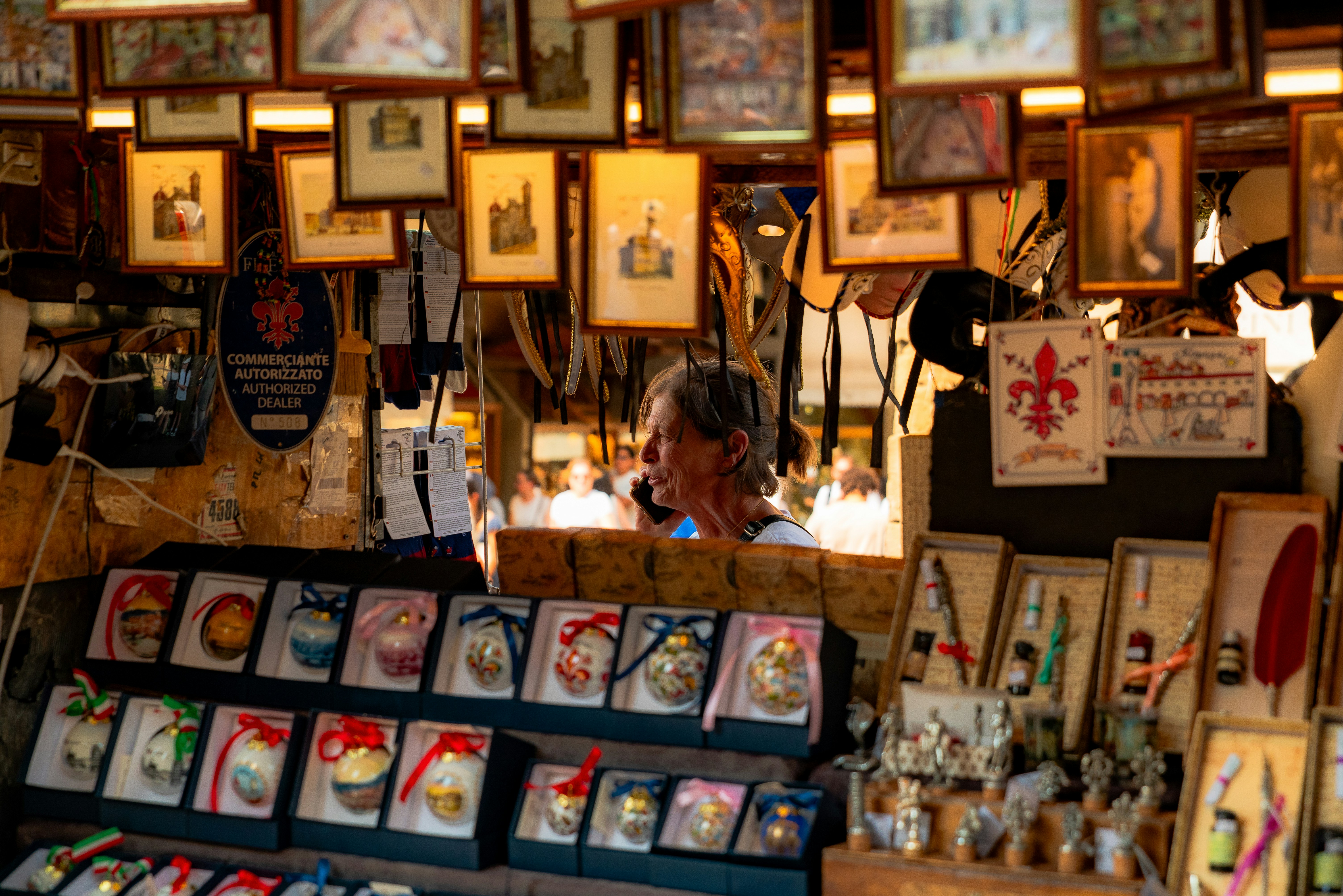 Shop interior with framed art and souvenirs