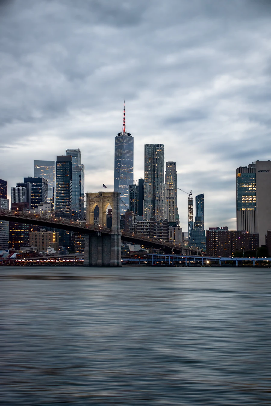 New York skyline and Brooklyn Bridge at dusk
