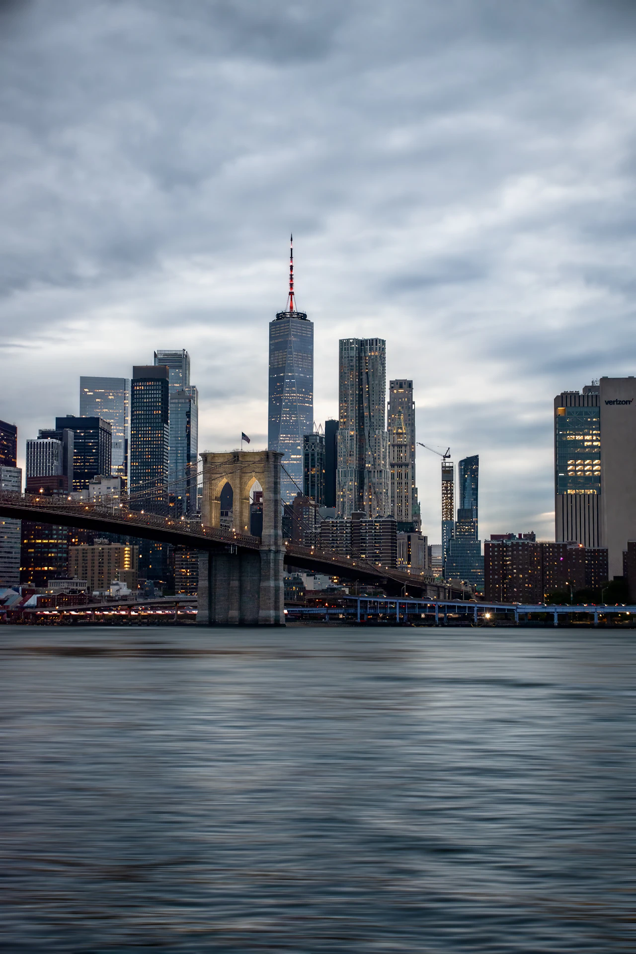 New York City skyline with Brooklyn Bridge at dusk