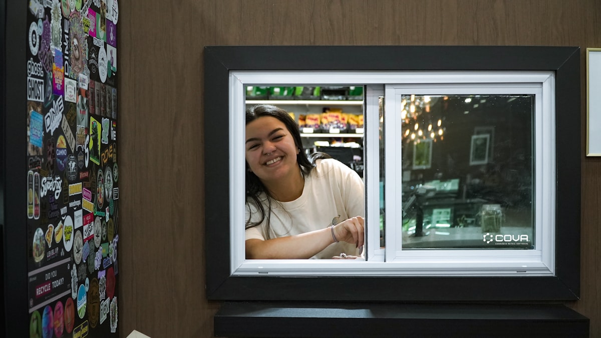 Retail staff member providing friendly customer service in store