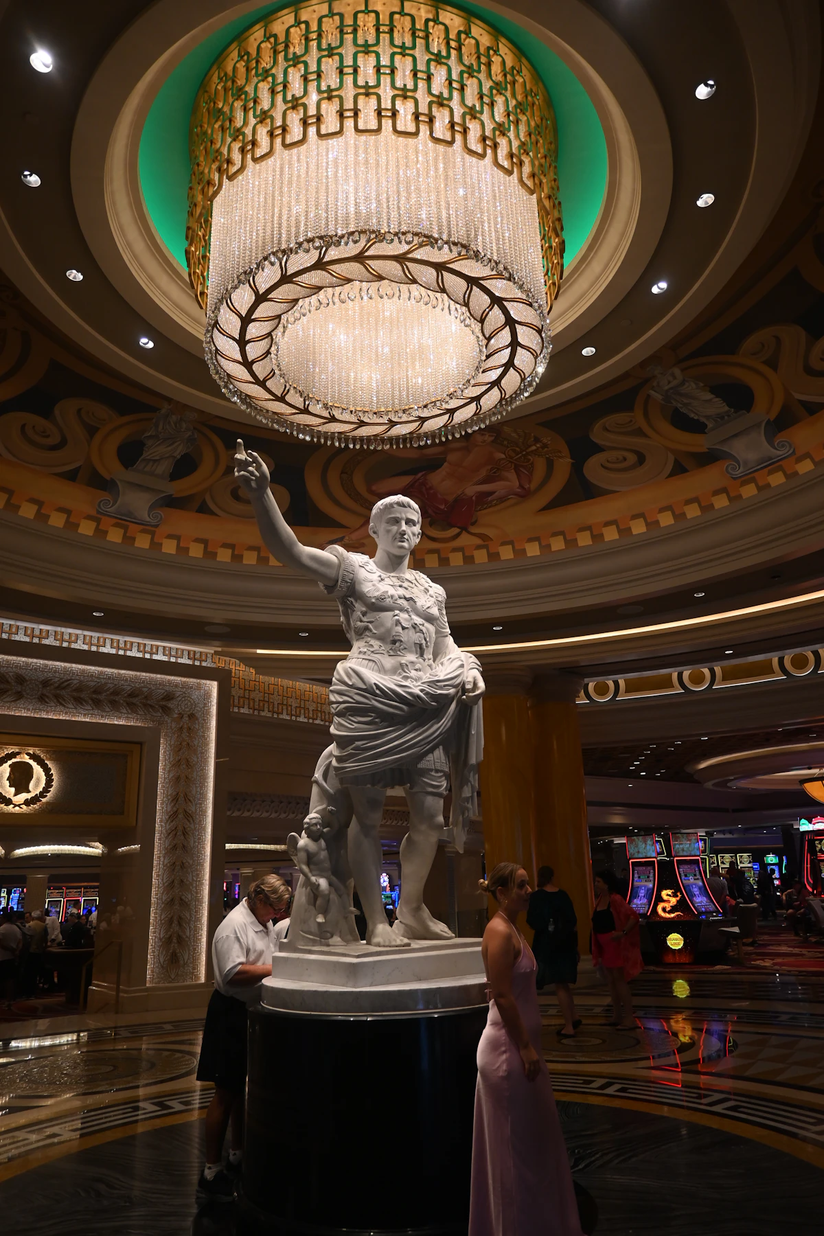 Grand spa interior with statue and chandelier