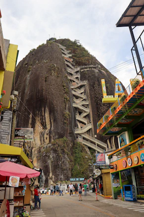 El peñol rock with steep stairs and colorful buildings