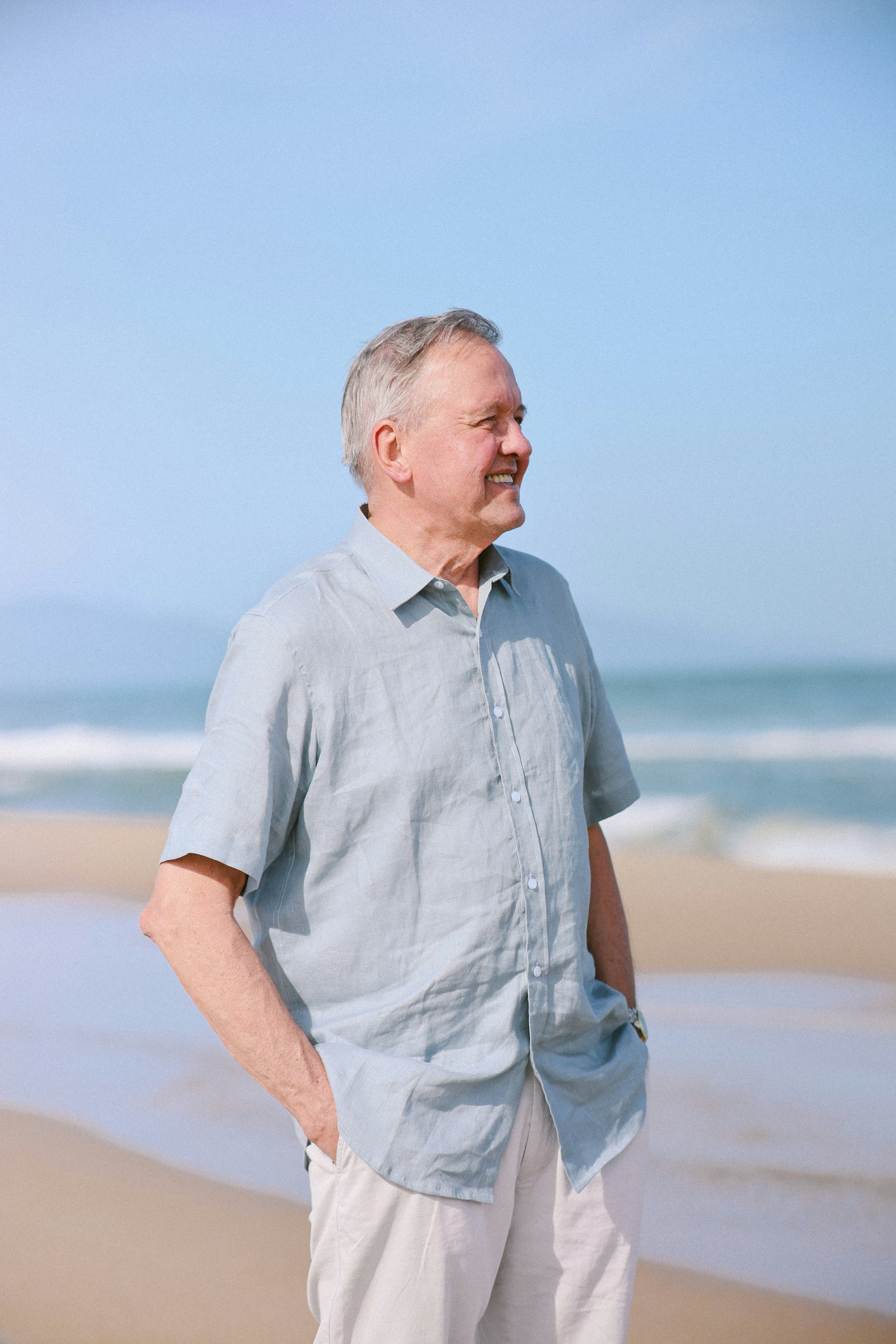 Elderly man smiling on a beach
