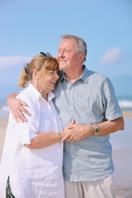 Elderly couple embracing on a sunny beach