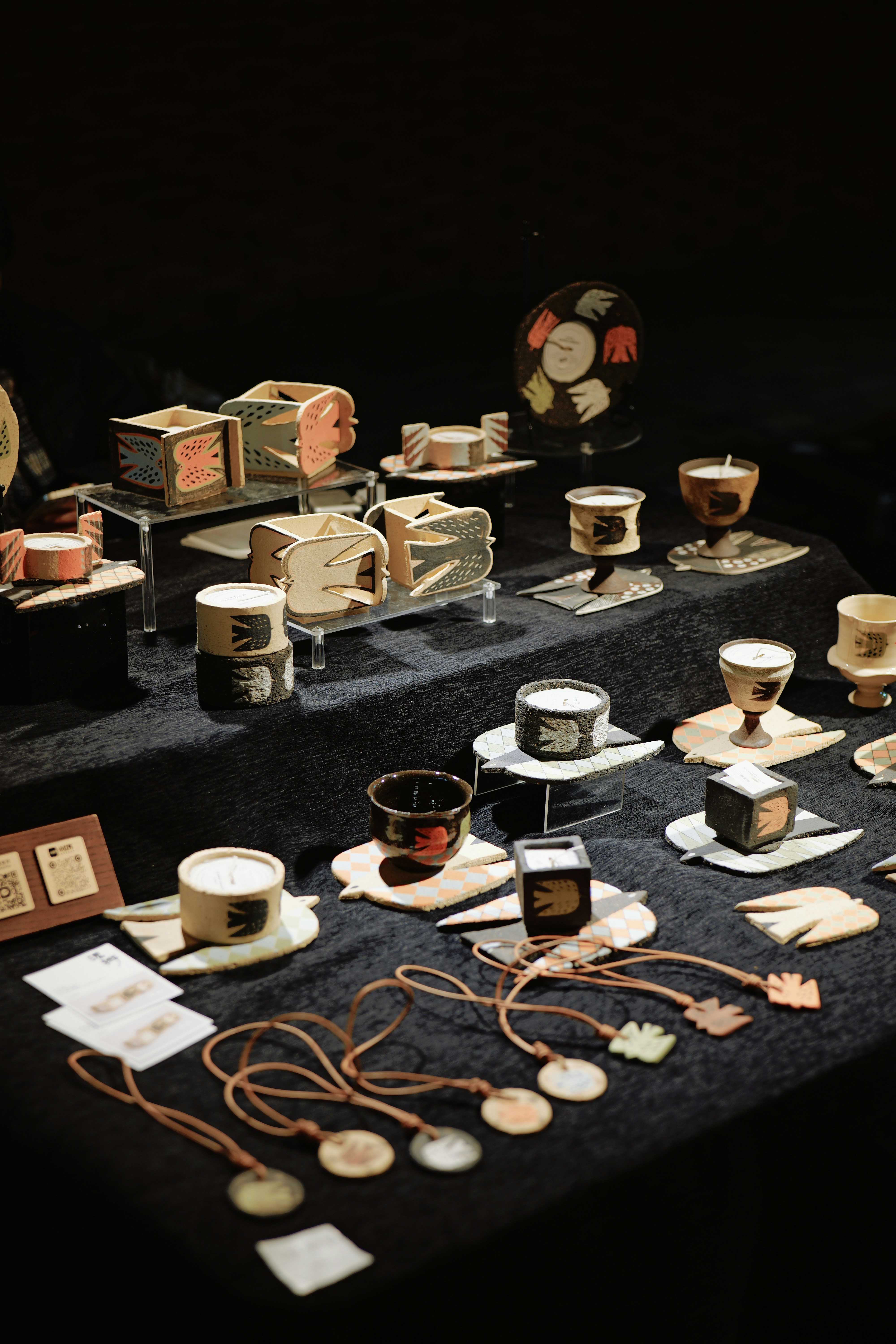 Various handcrafted candles and decorative items displayed.