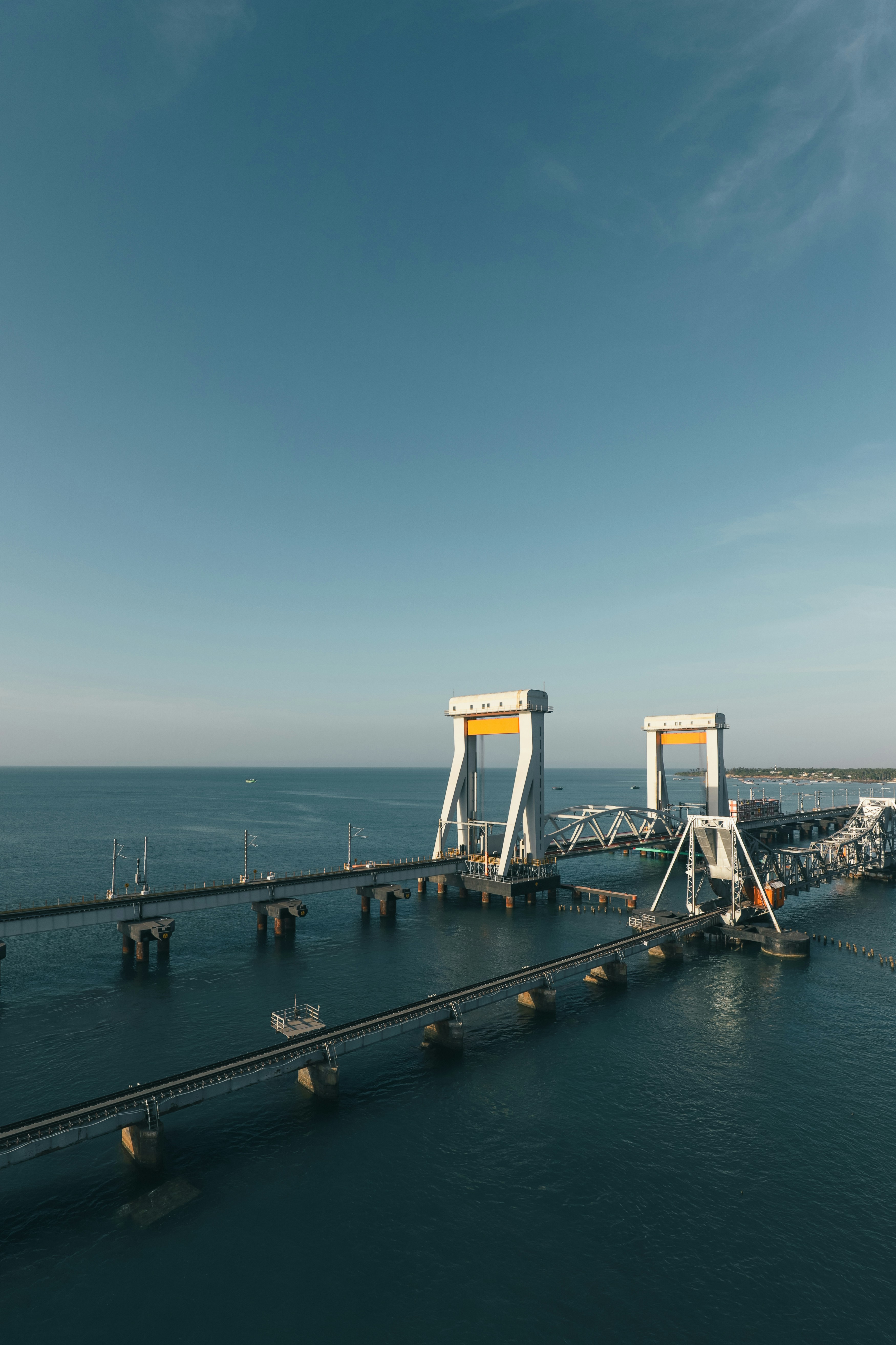 Bascule bridge over calm blue ocean under sky