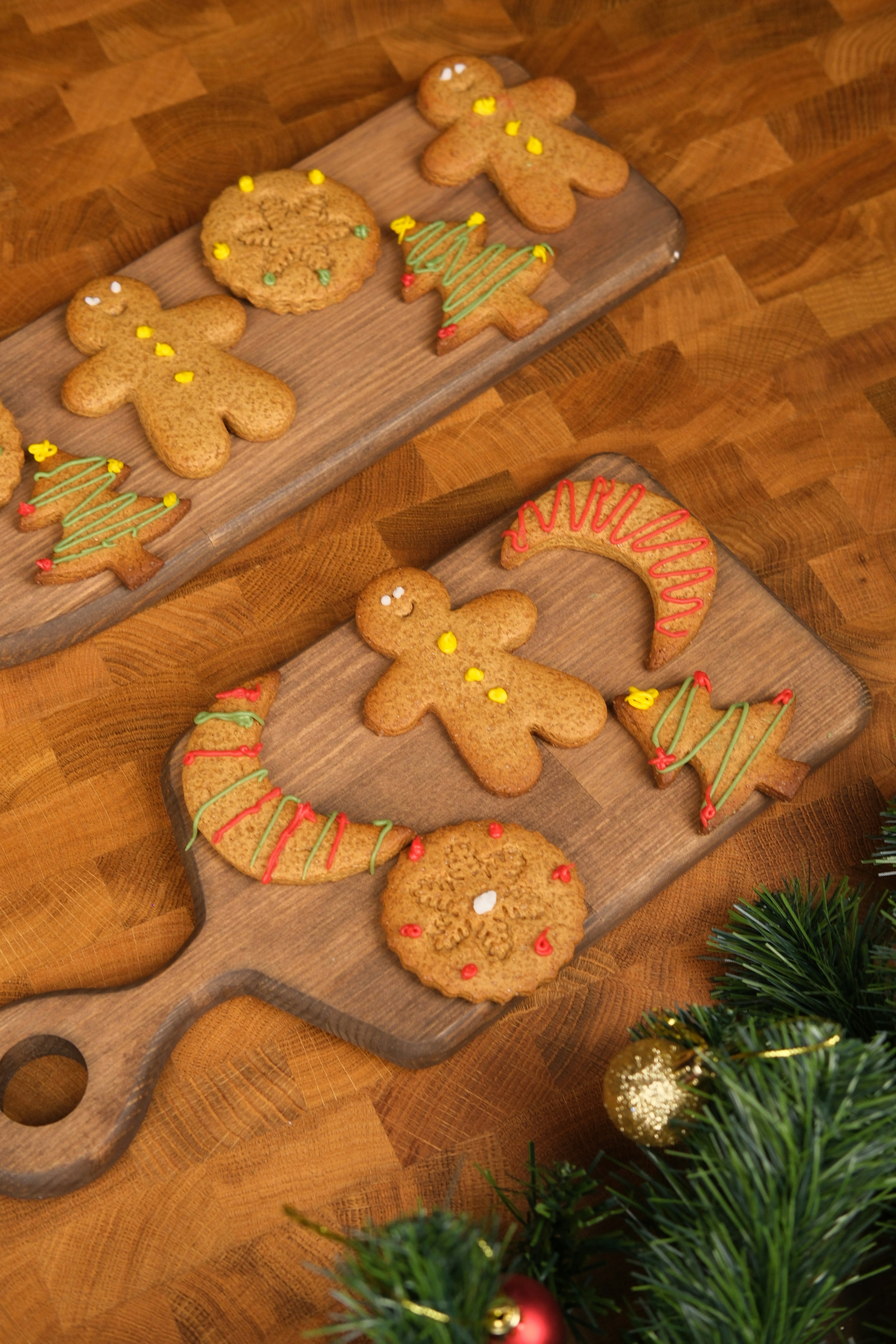 Christmas gingerbread cookies on wooden boards with festive decorations