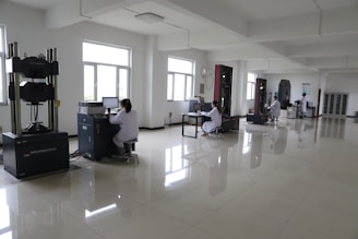 Workers in a laboratory with testing equipment