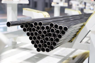 Stack of metal pipes on a factory line