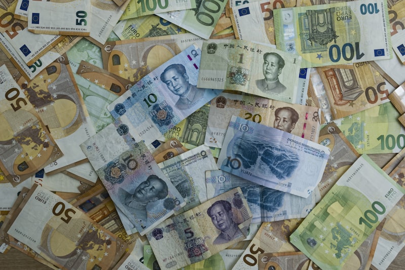 Euro and Chinese yuan banknotes scattered together