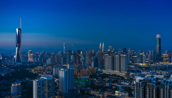 Kuala Lumpur skyline illuminated at dusk