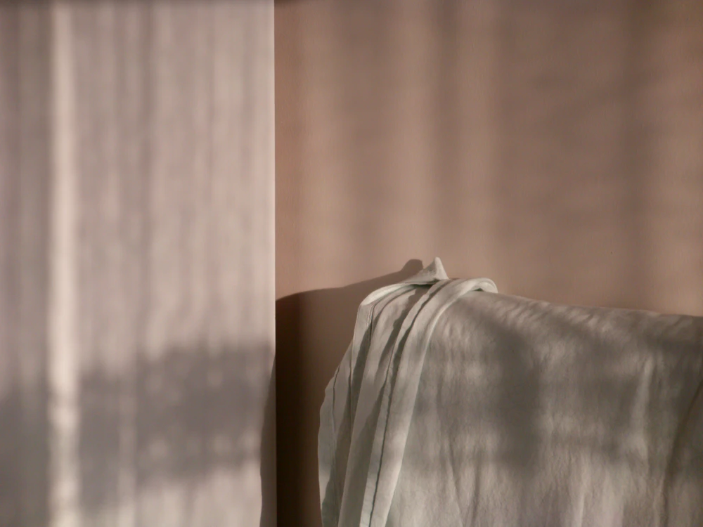Draped fabric catching dappled afternoon light.