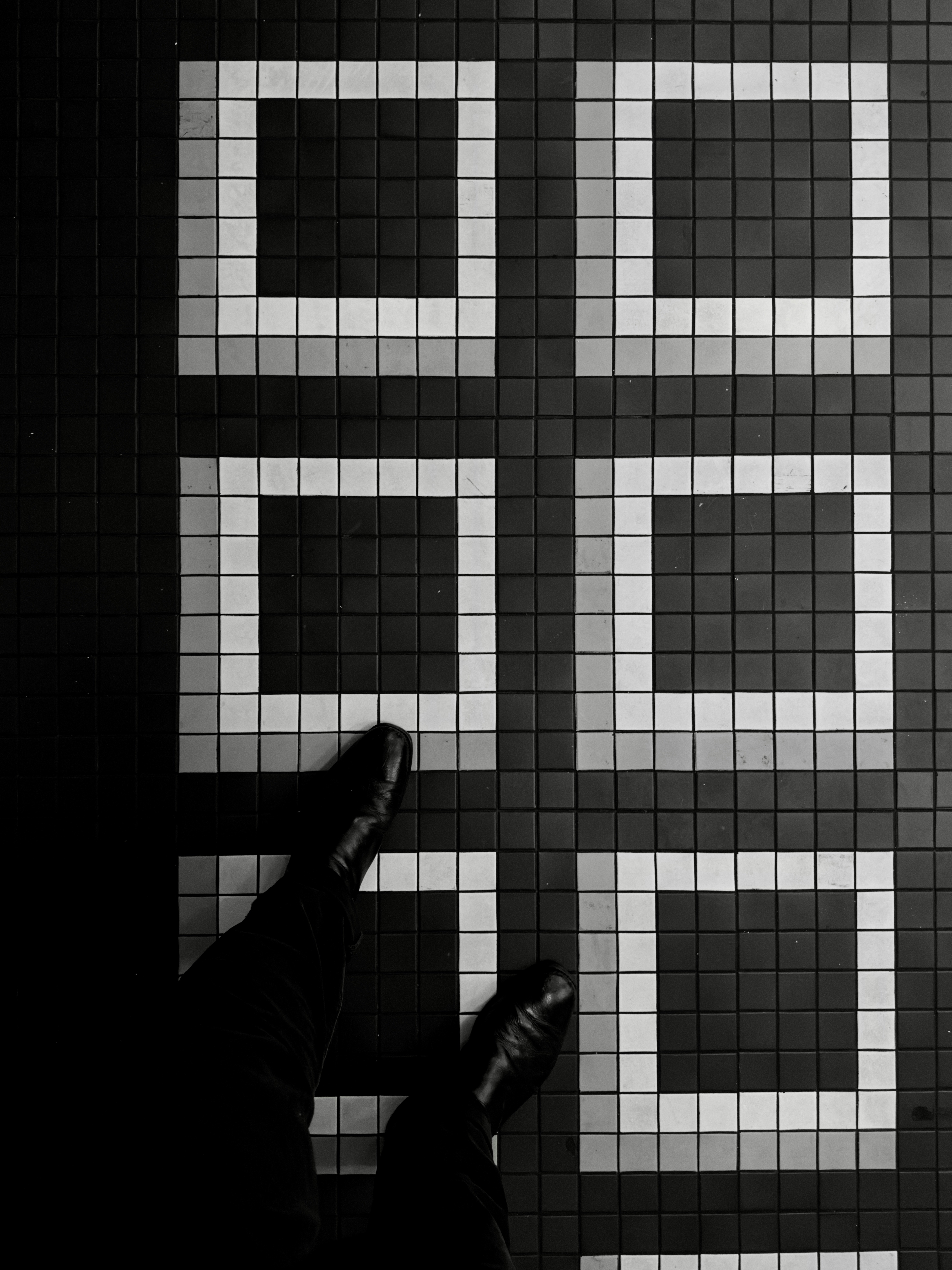 Black and white tiled floor with square patterns
