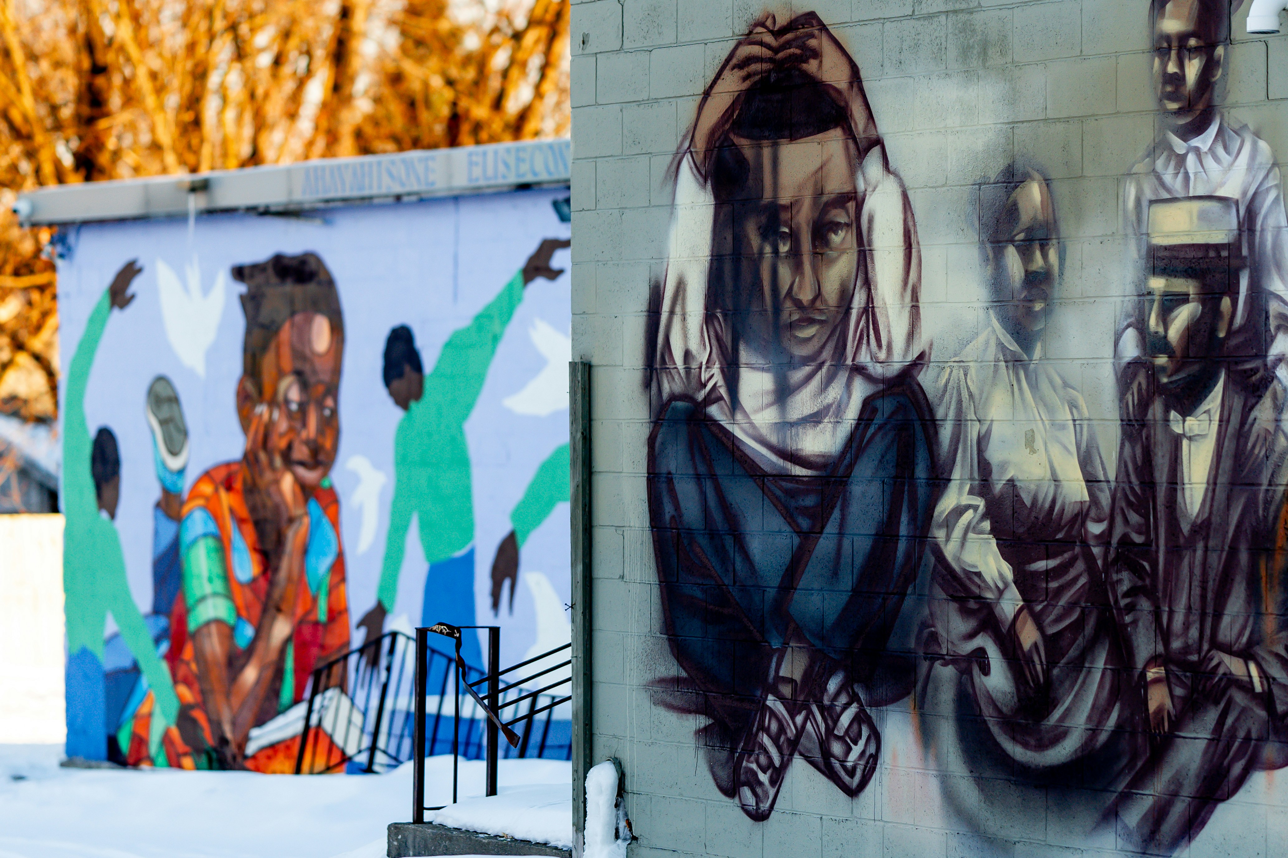 Graffiti art on a building wall in winter.