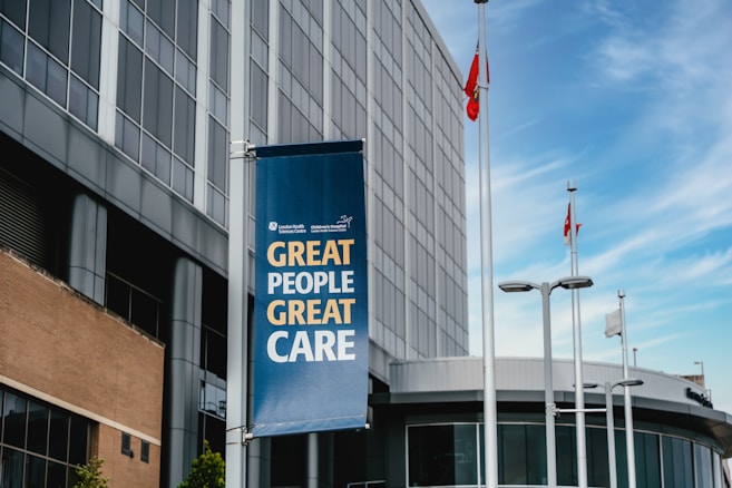 Modern building with a banner reading "great people great care"