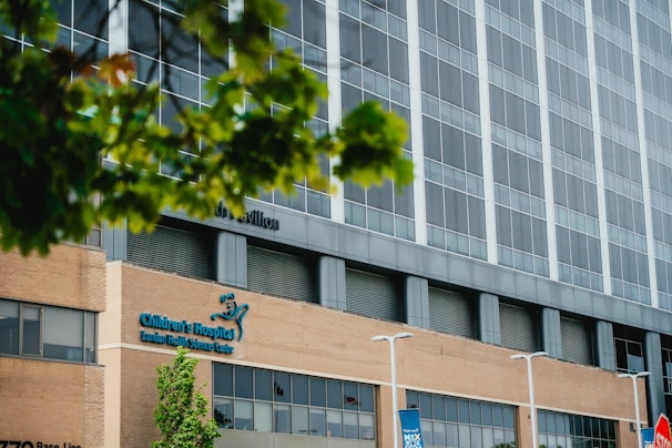 Modern hospital building with large windows and tall windows.