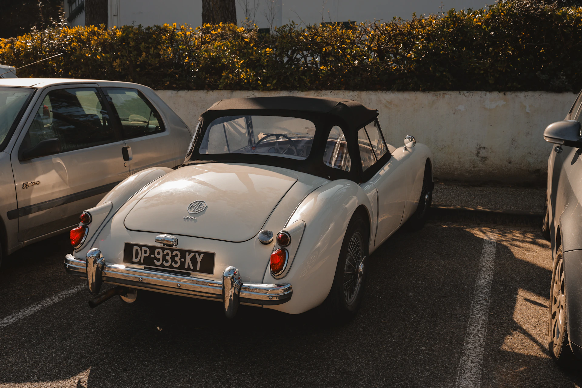 White vintage convertible car parked outdoors