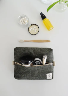 Toiletries and personal care items laid out flat.