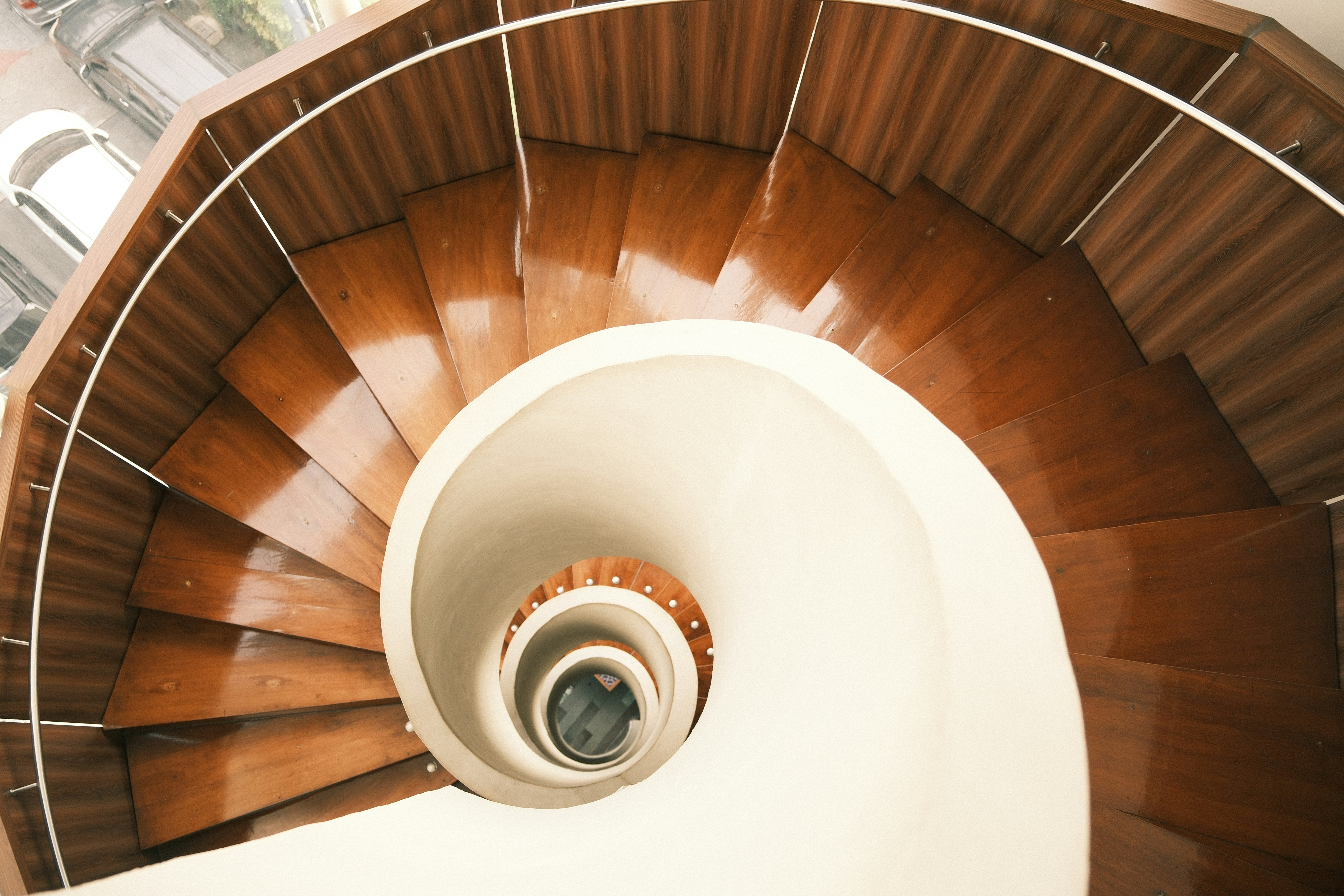 Elegant spiral staircase in Jakarta with modern wood and minimalist design