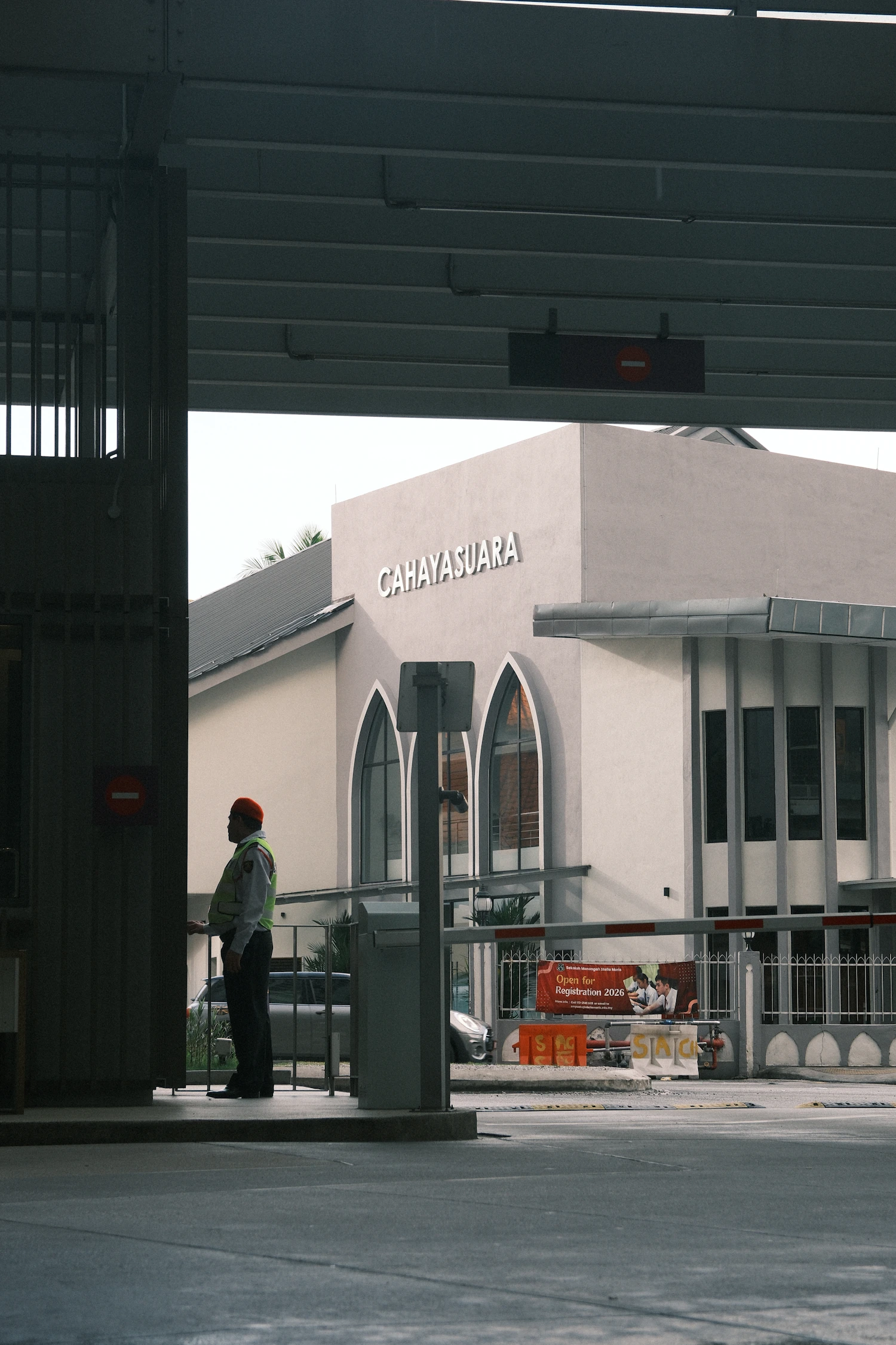 Security guard overseeing access at a modern building entrance