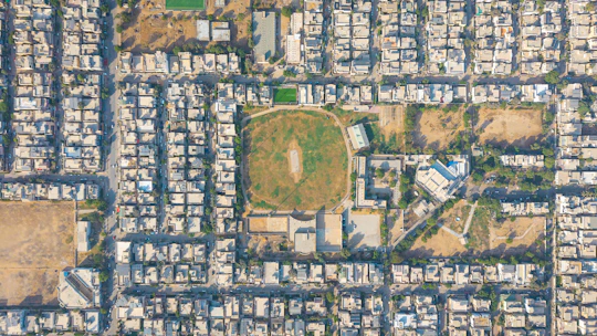Aerial view of a residential area with a sports field.