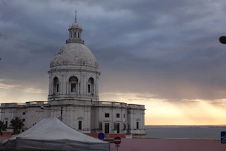 White domed building on the waterfront at sunset