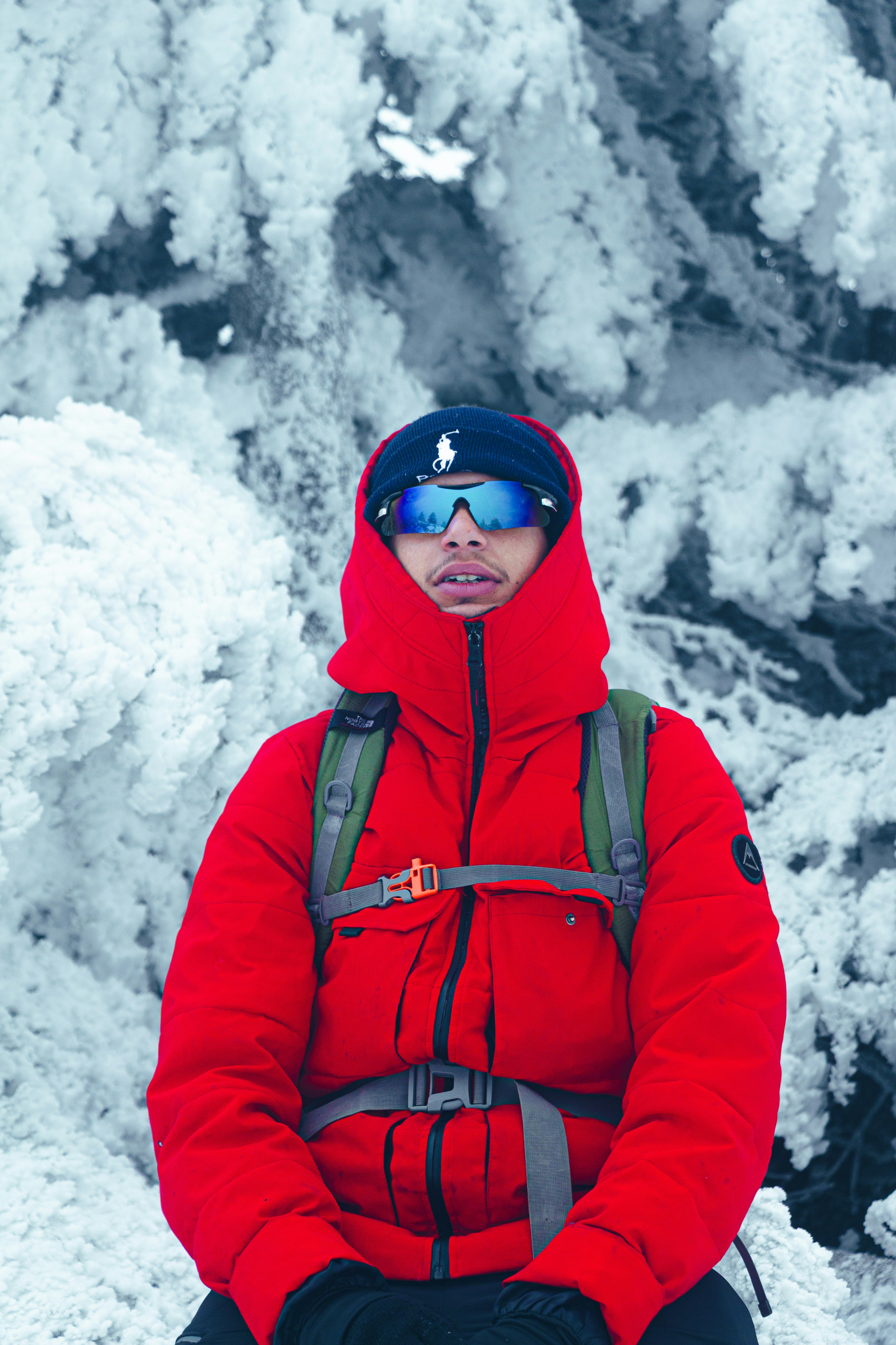 Man in red jacket in snowy forest
