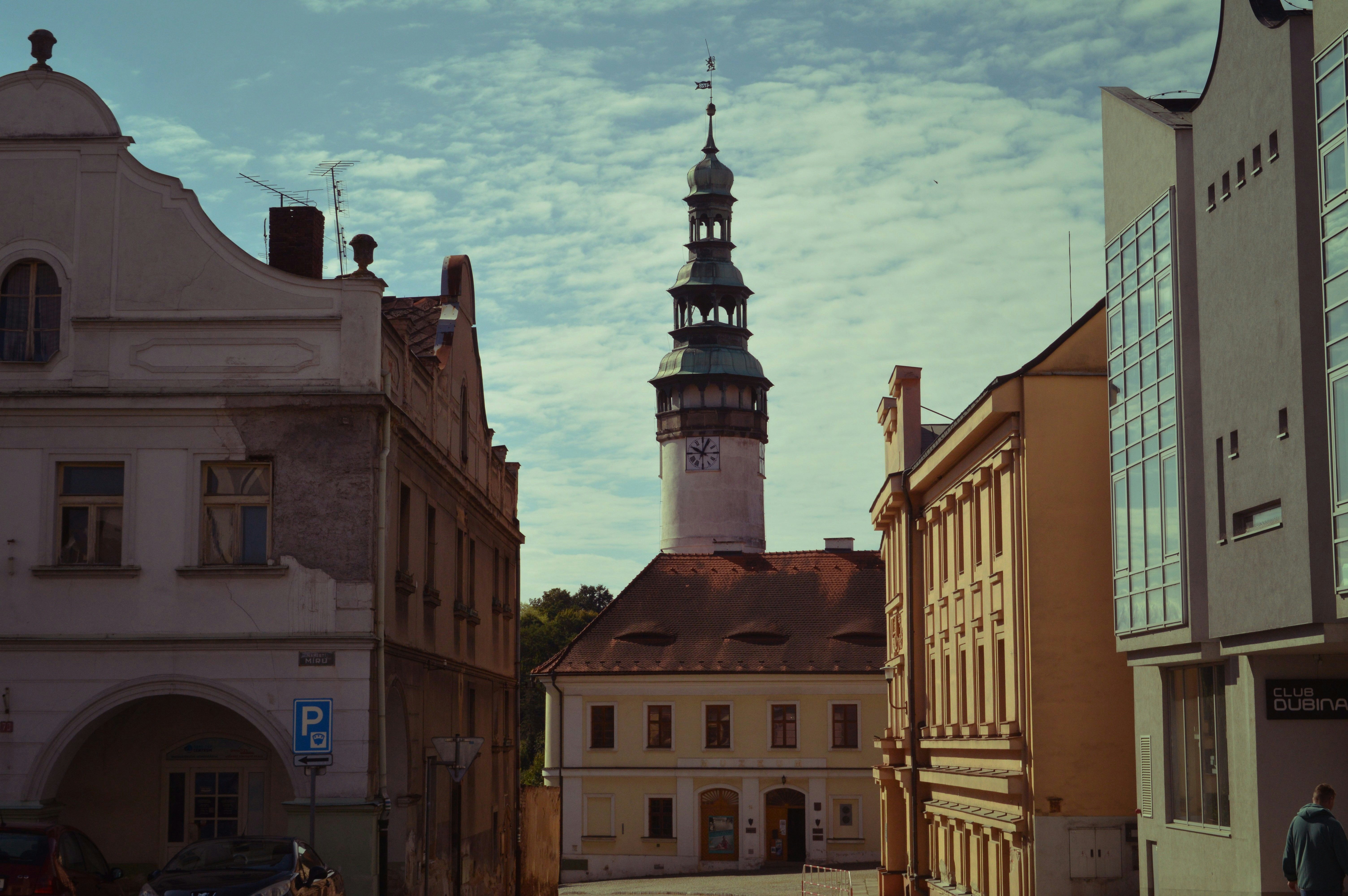 Historic european town square with a tall clock tower.
