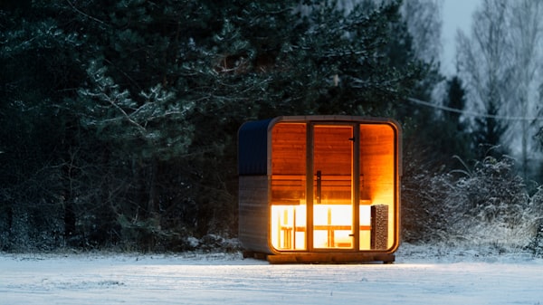 Cozy sauna cabin in snowy forest
