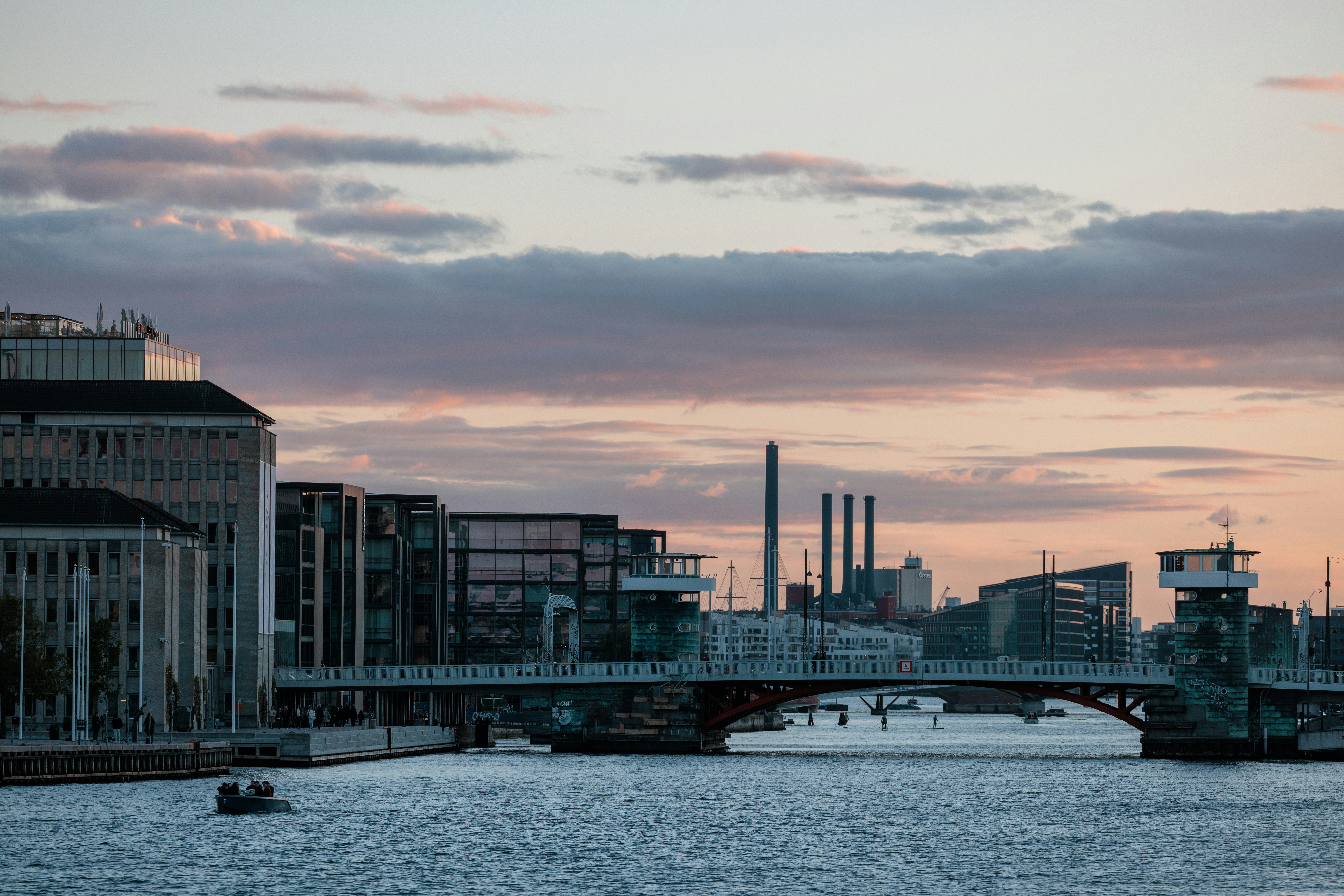 Cityscape with bridge and river at sunset