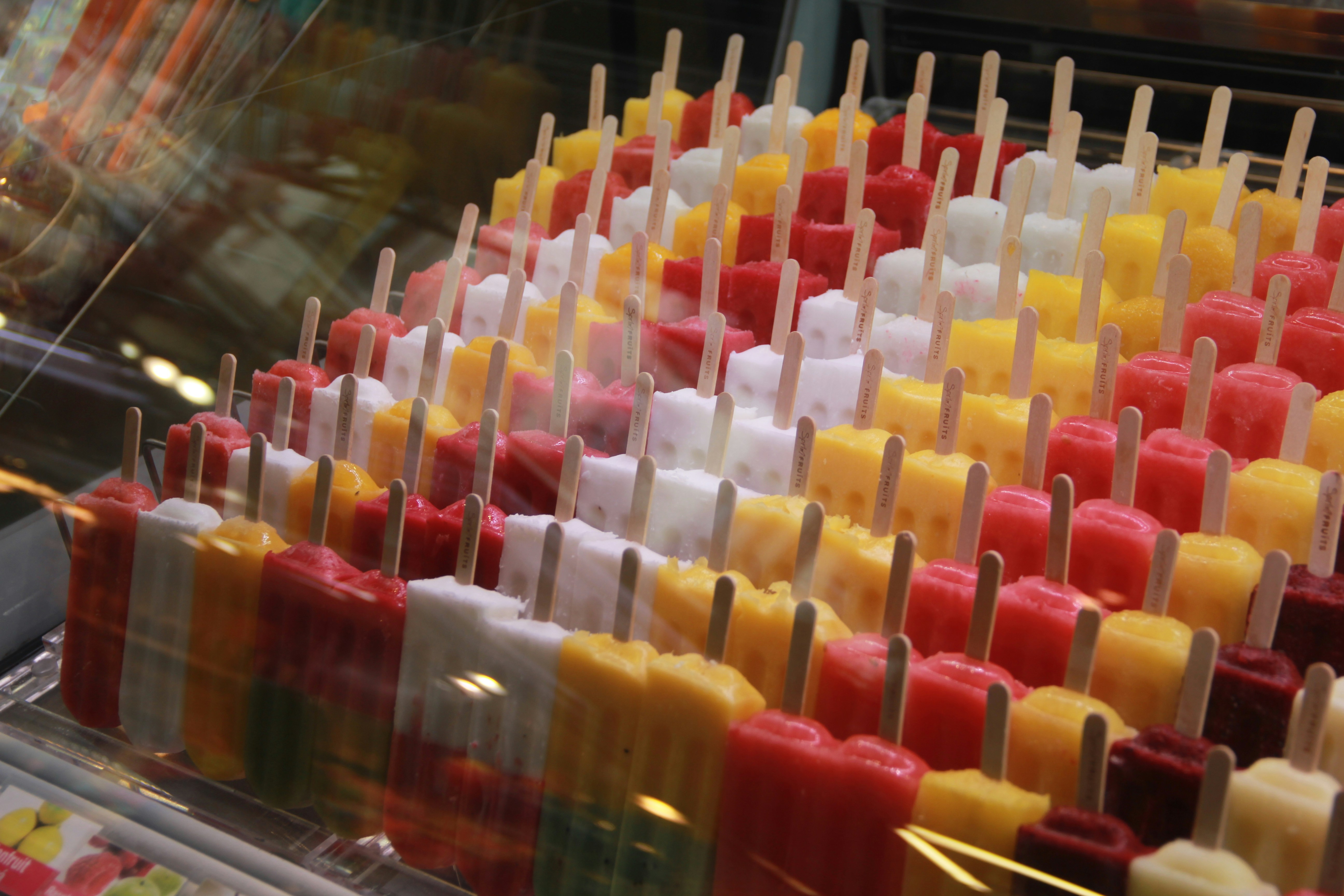 Rows of colorful popsicles arranged neatly.