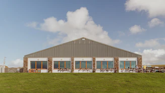 Modern building with large windows under blue sky