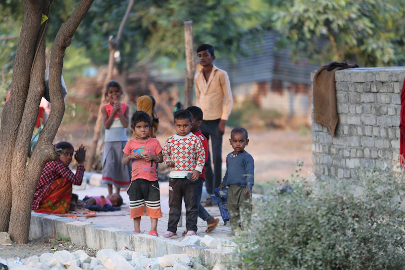 Children standing together in a rural outdoor setting