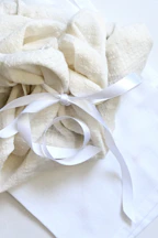 A white cloth tied with a white ribbon