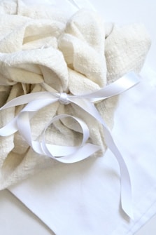 A white cloth tied with a white ribbon
