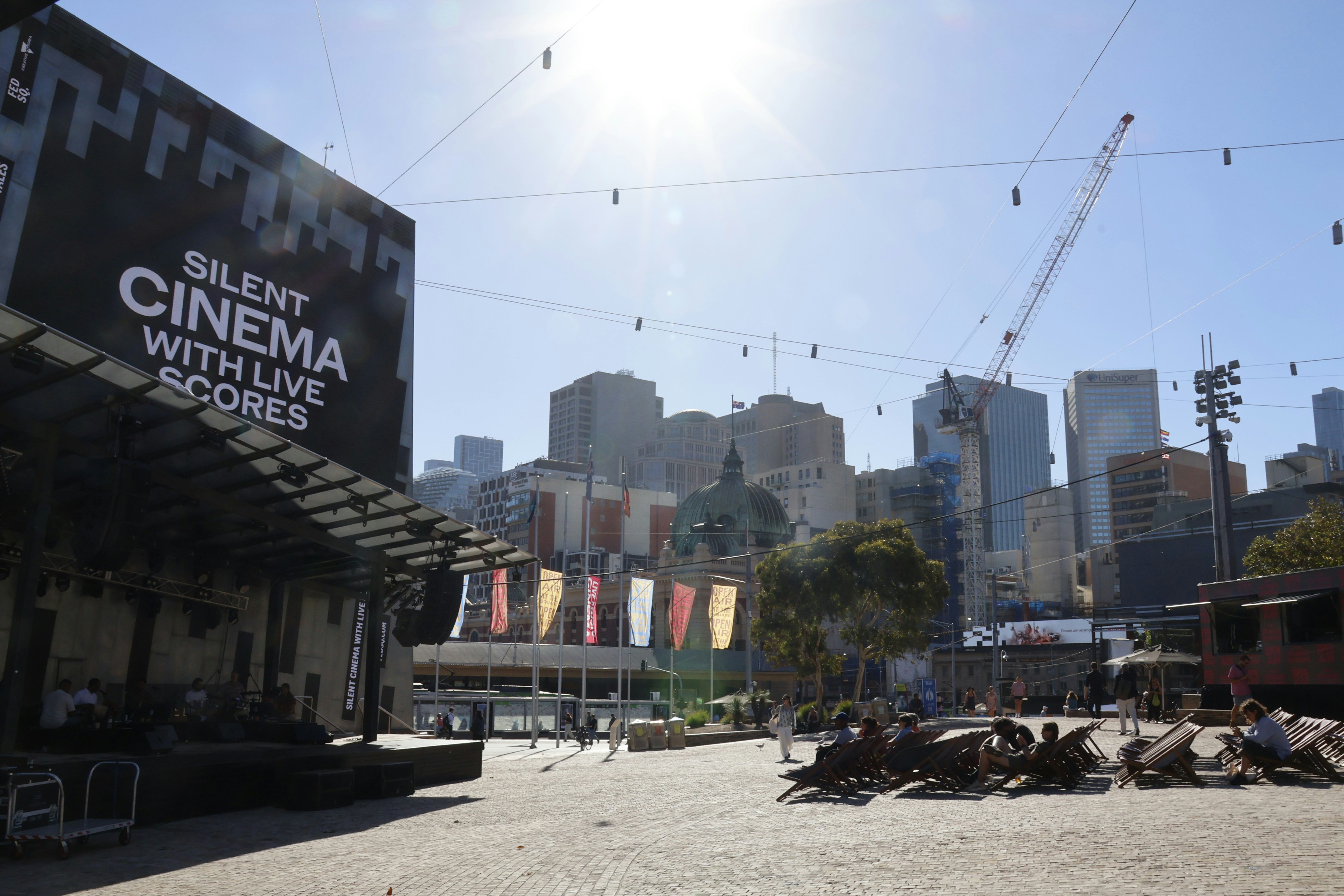 Outdoor cinema setup with city skyline background