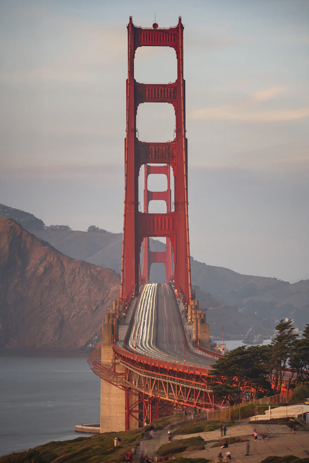 Golden gate bridge with light trails at dusk