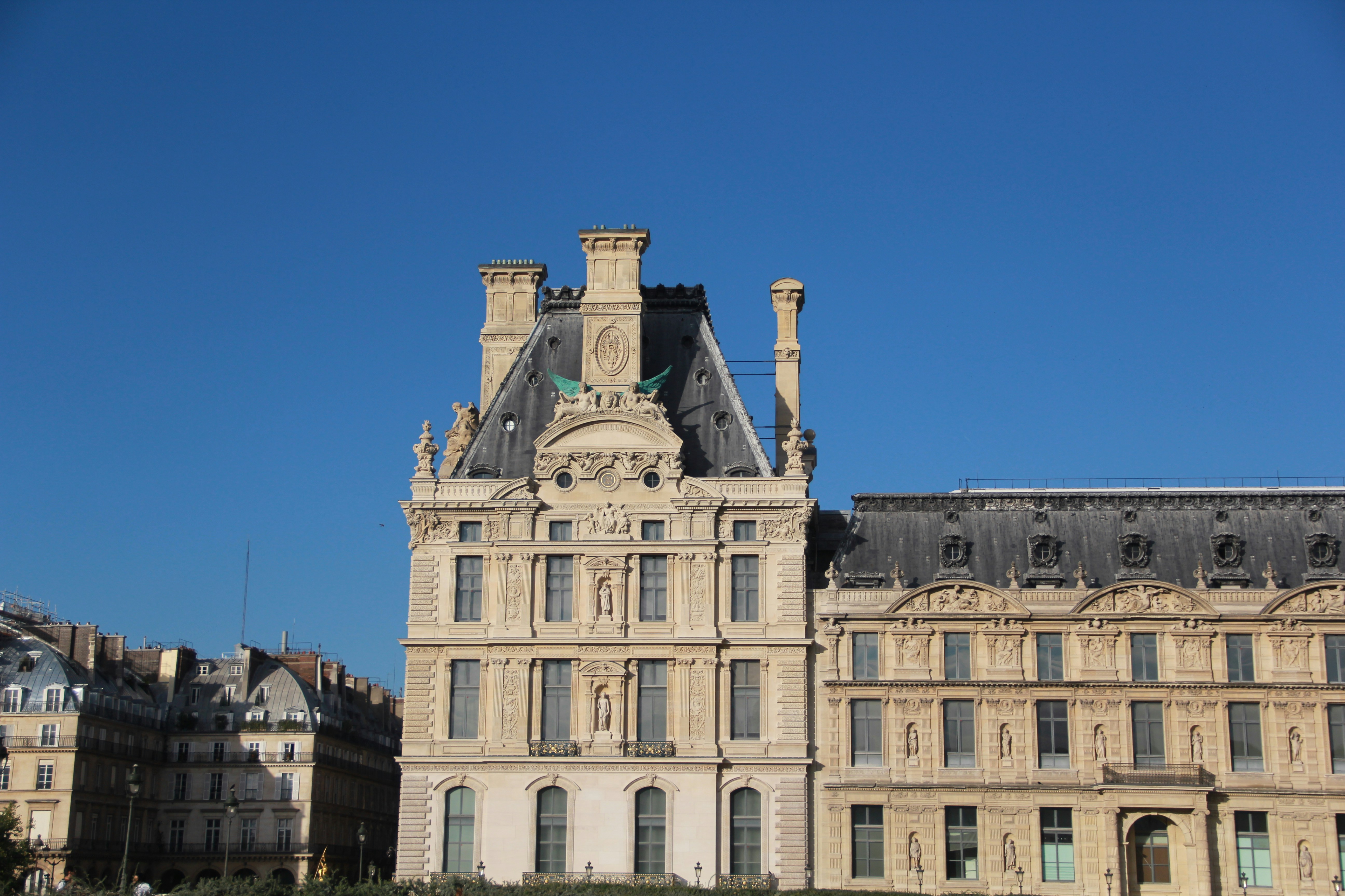 Ornate historic buildings under a clear blue sky