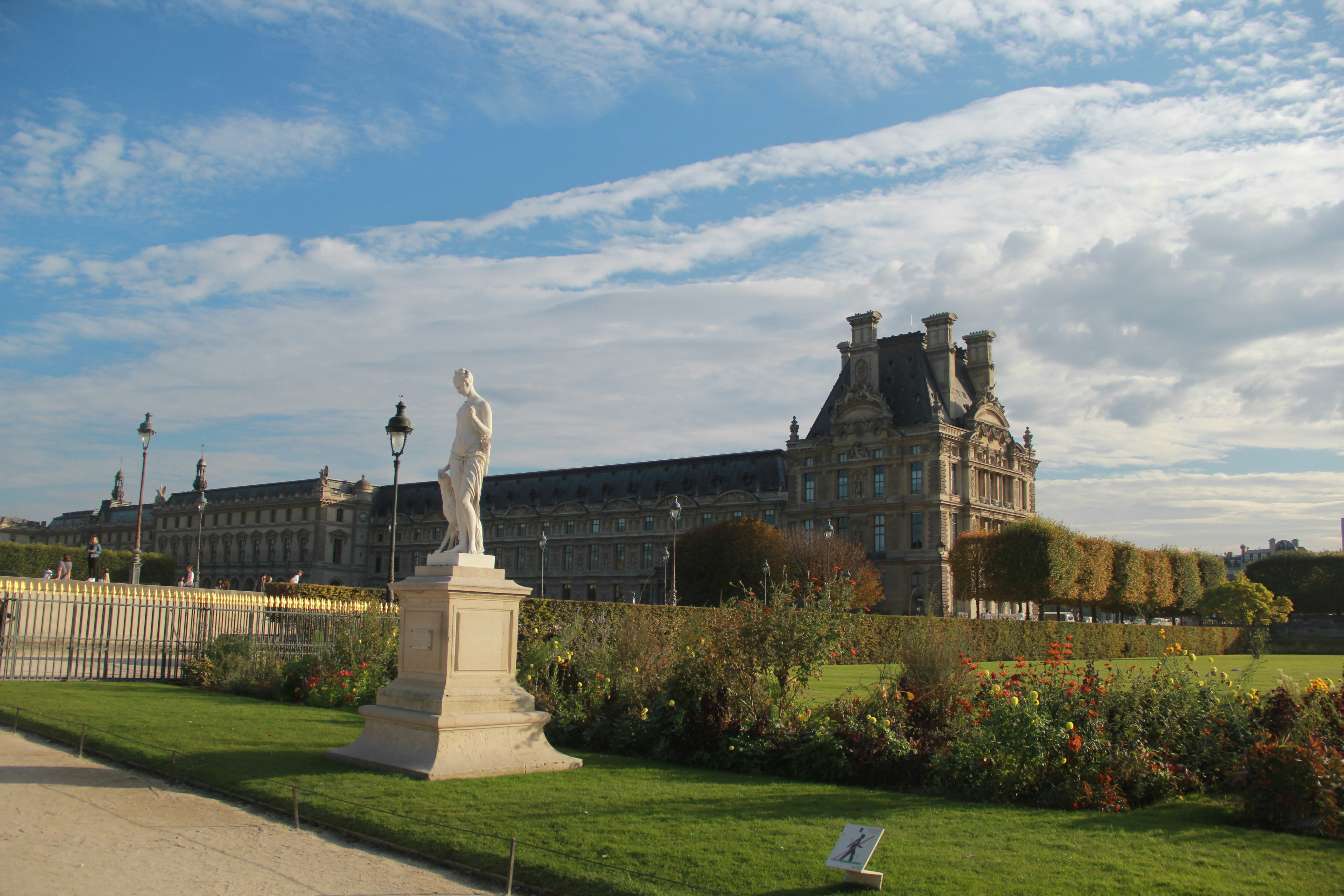 Historic building and statue in a garden