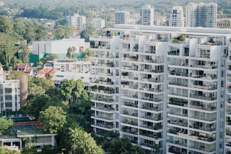 Modern apartment buildings with balconies and trees in Semmancheri, Chennai