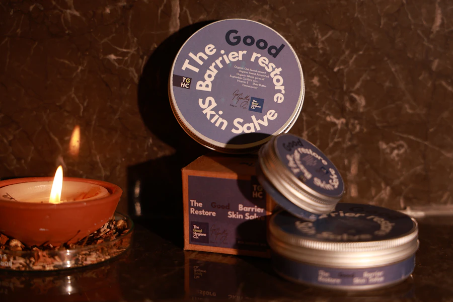 CBD skin salve tins stacked beside a candle