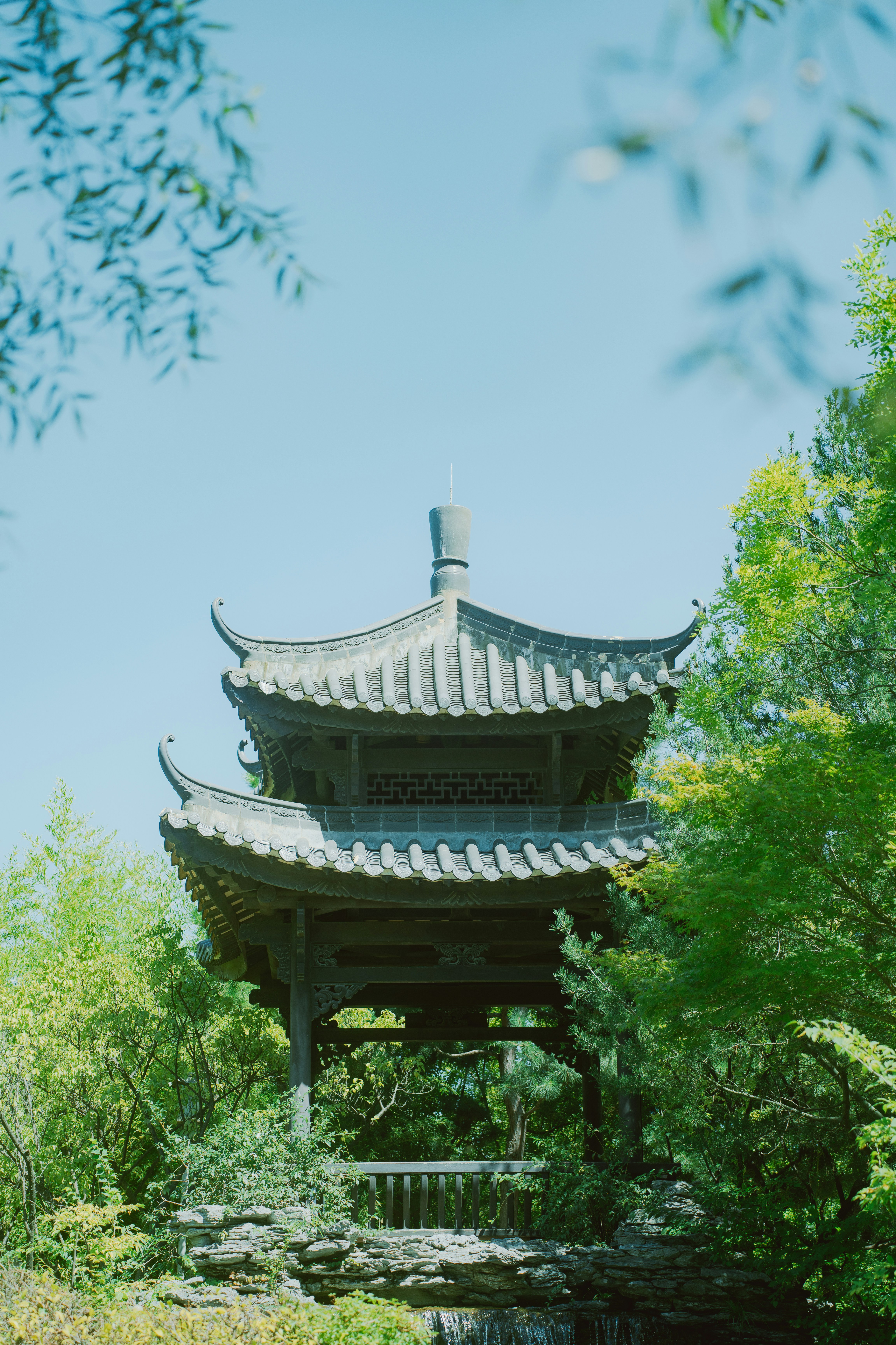 Traditional pagoda surrounded by lush green trees
