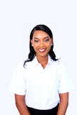 A young professional woman smiling against a white background.
