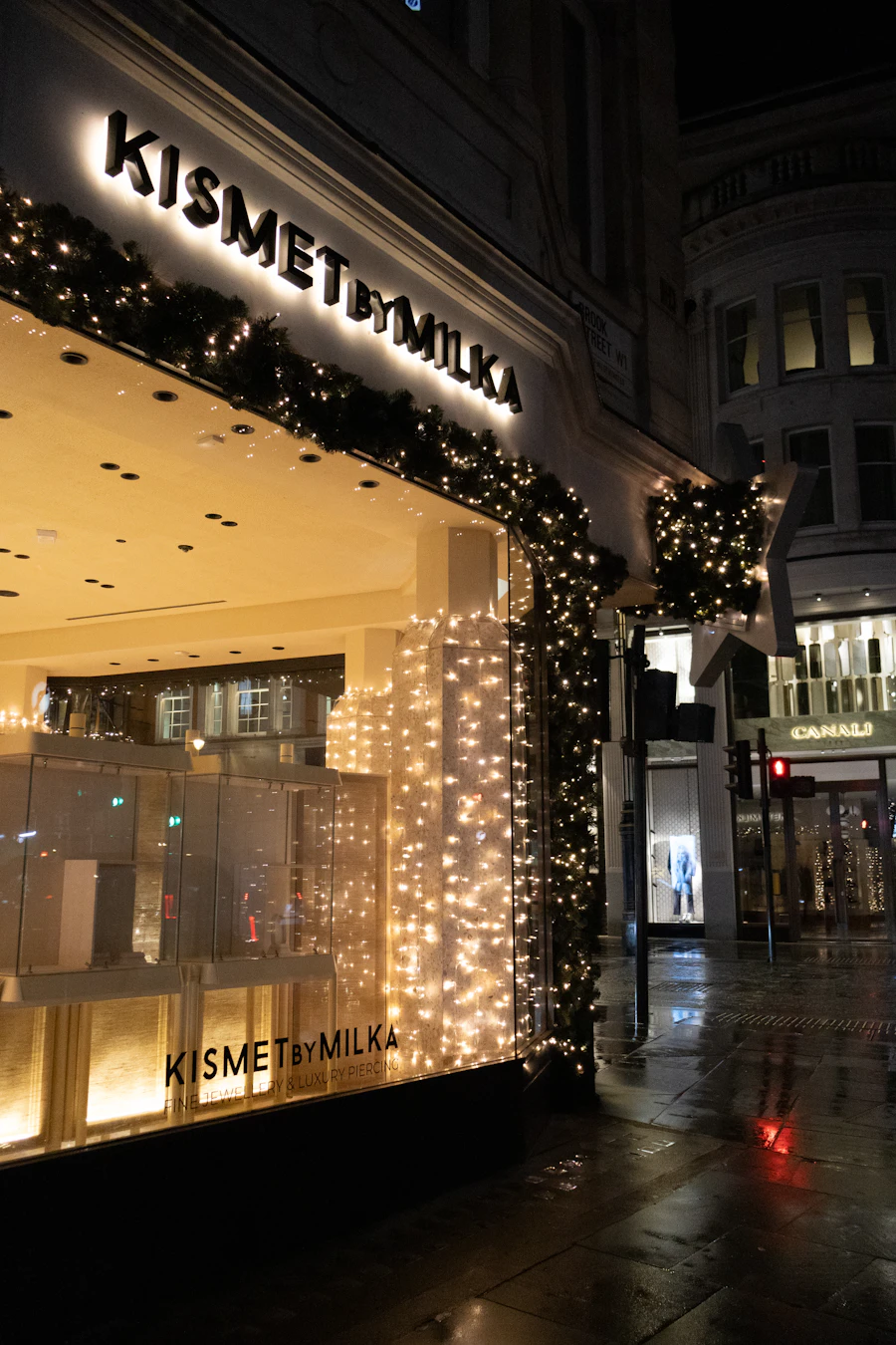 Commercial building entrance decorated with holiday lights