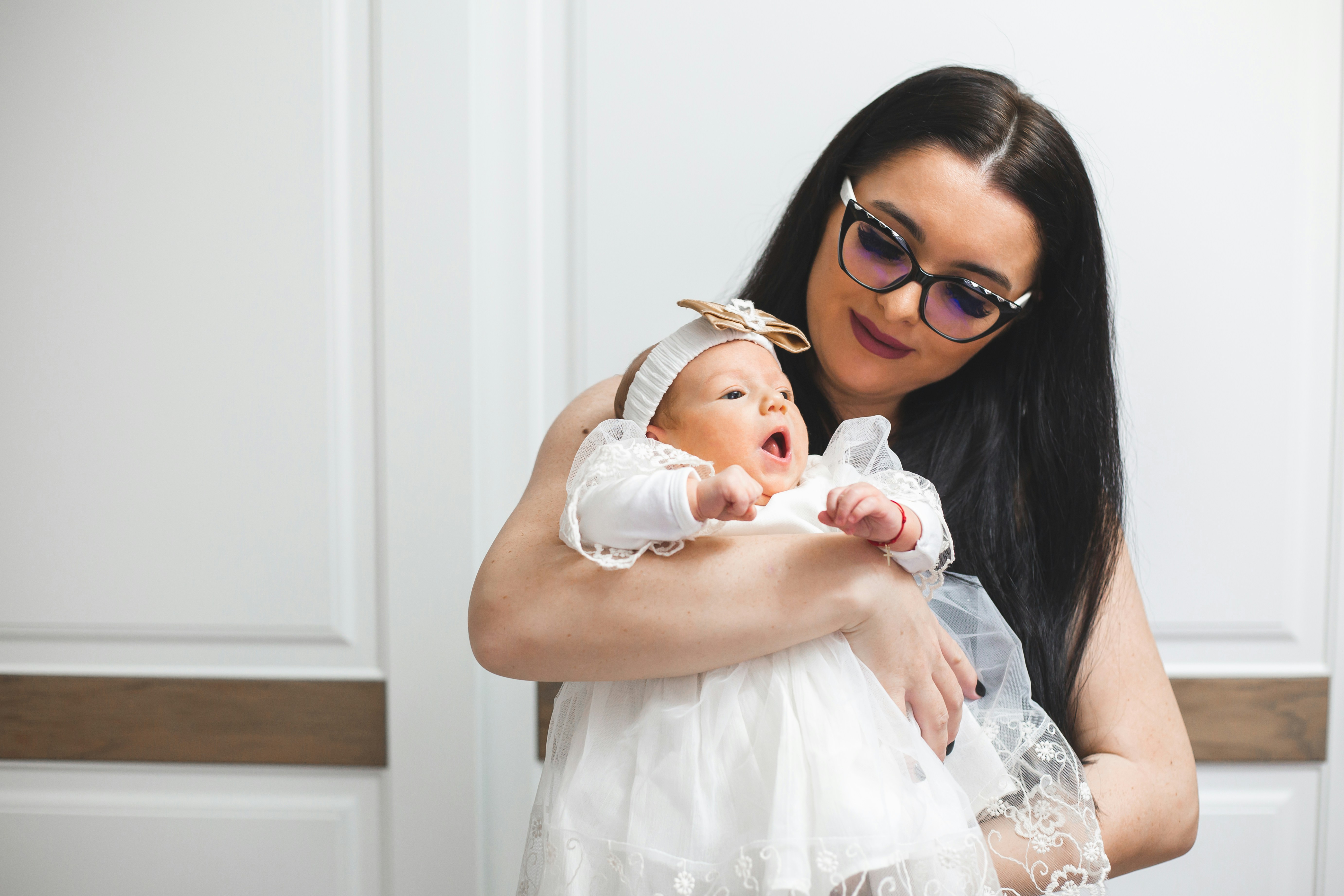 Mother holding her newborn baby girl