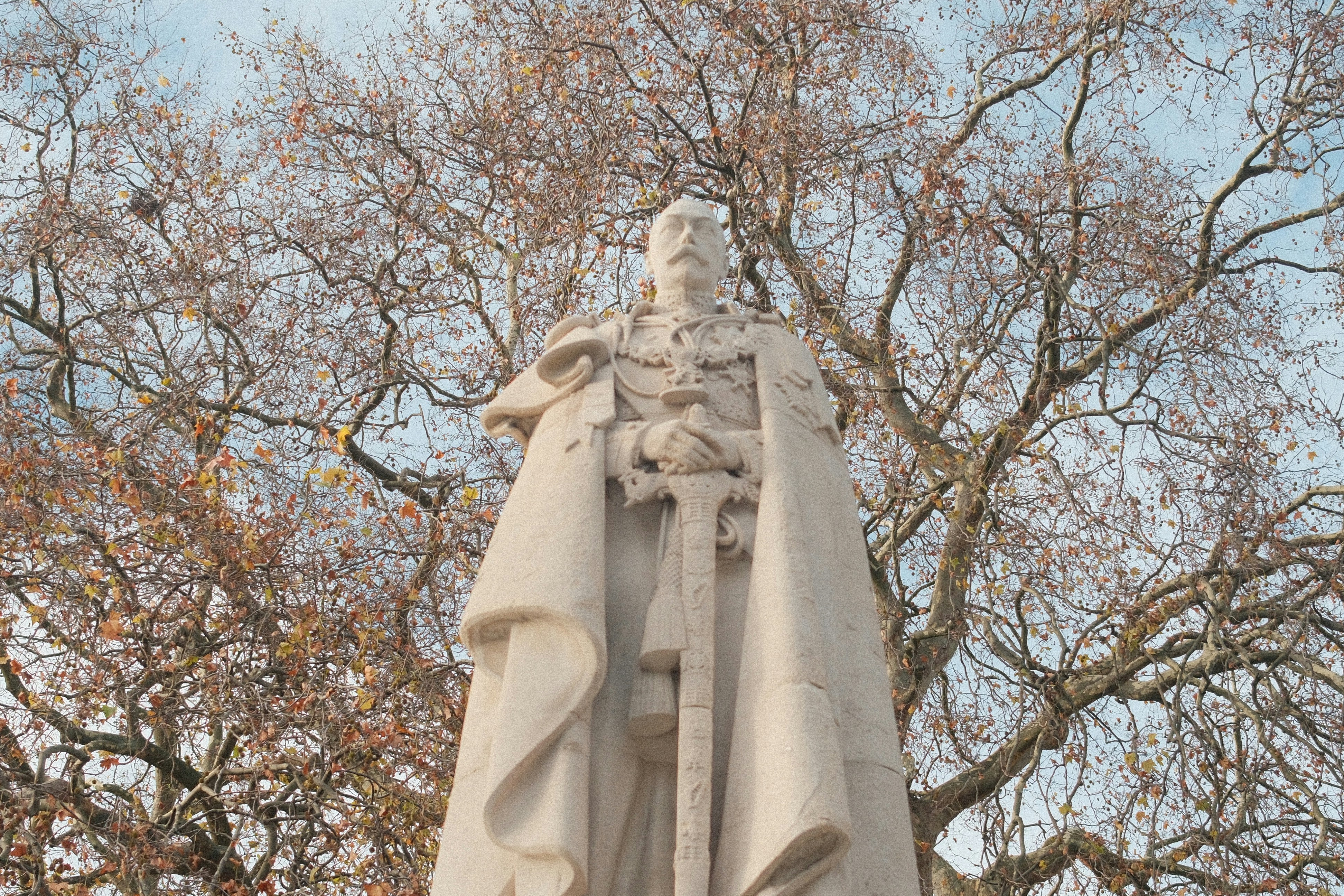 A marble statue of a man in regal attire.