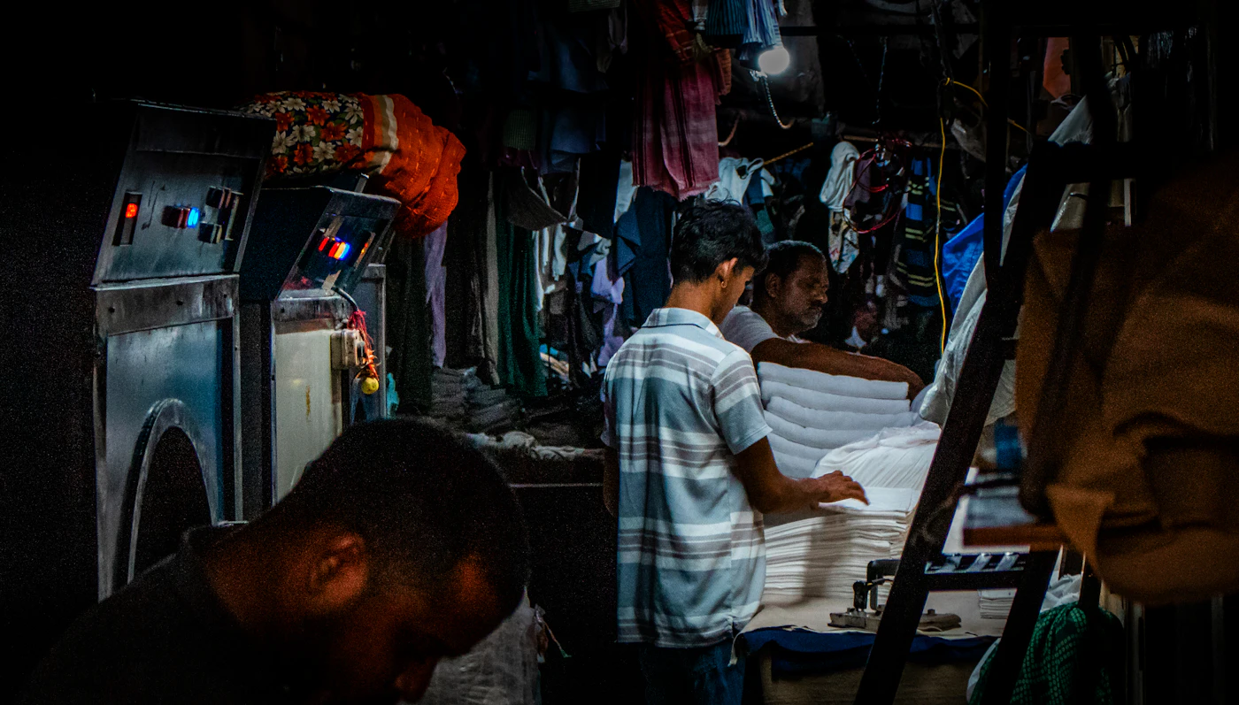 Laundry workers folding clothes