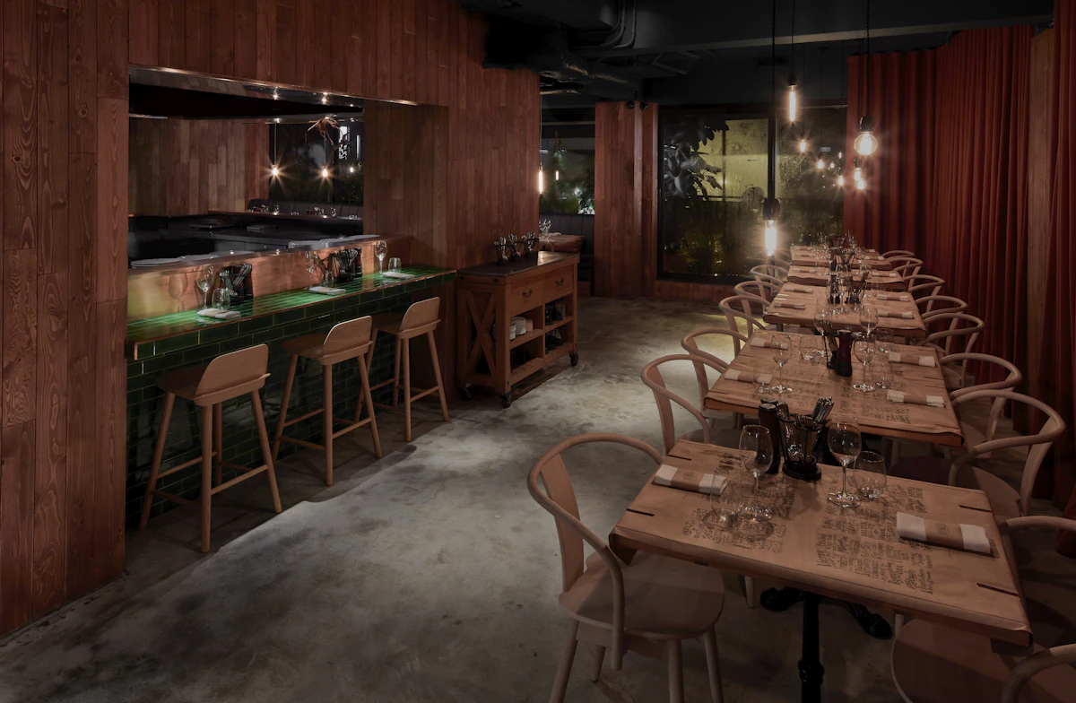 Modern restaurant interior with bar and dining tables