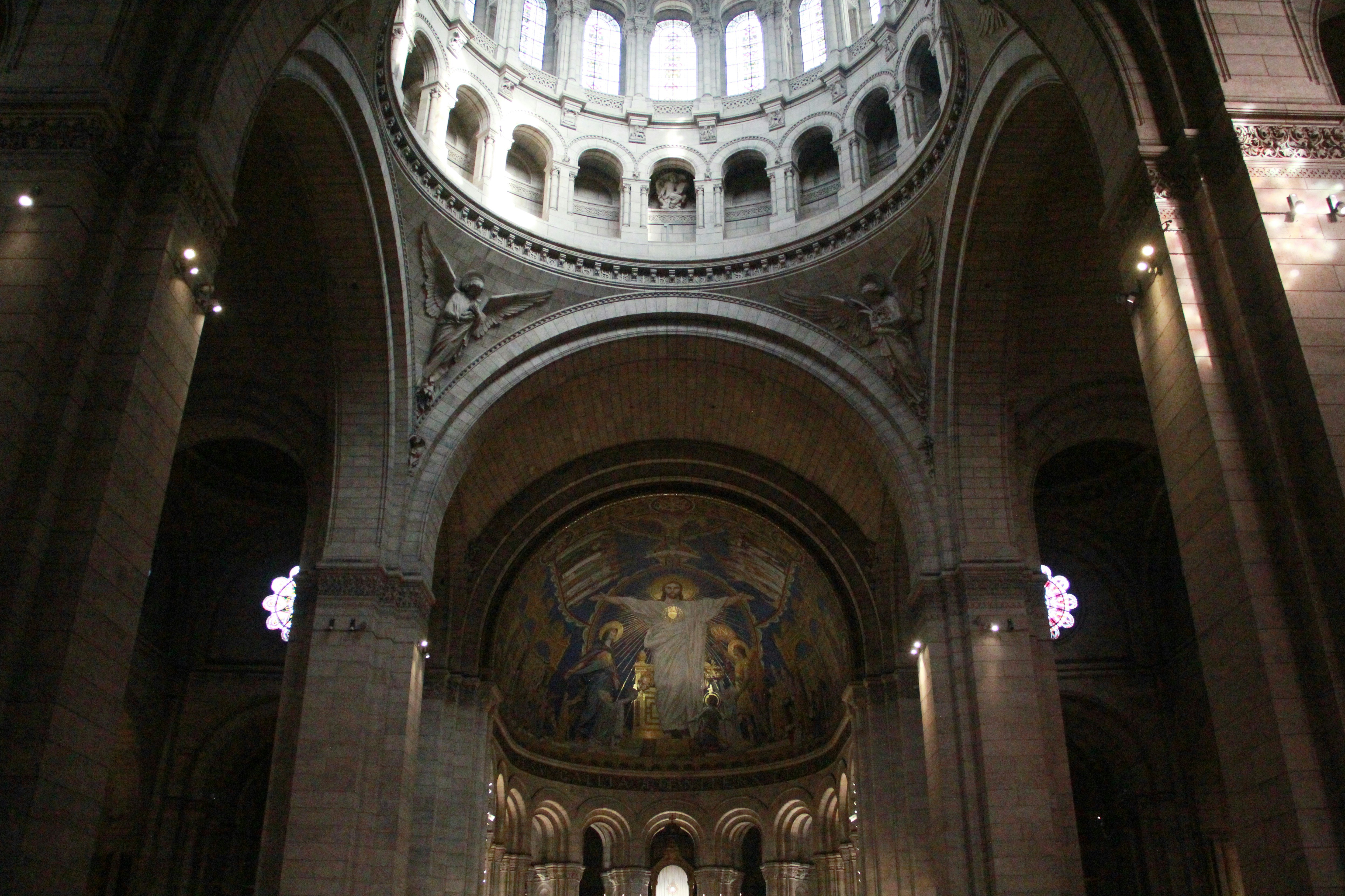 Interior of a grand cathedral with a large dome.