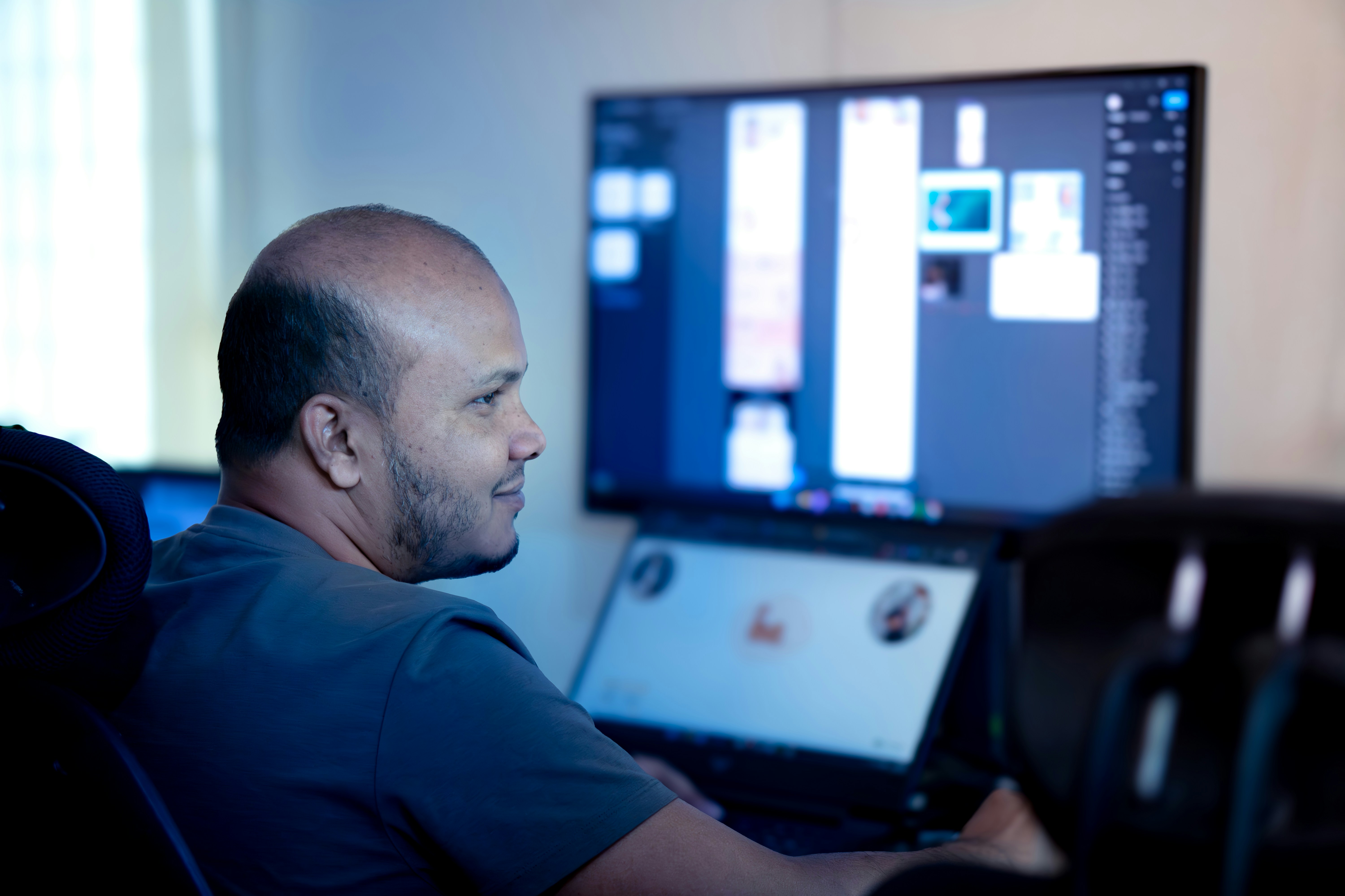 Man at dual monitors